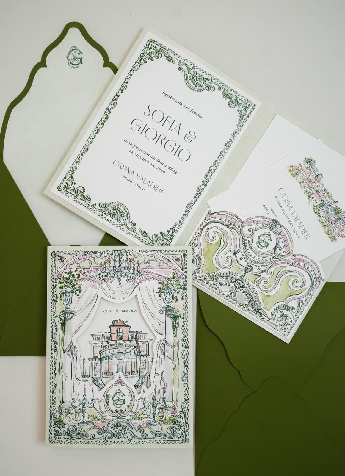 IuMi Studio invitation suite in green and pink: invitation with a hand-drawn baroque frame, die-cut theatre curtain cover revealing the venue, monogrammed envelope liner